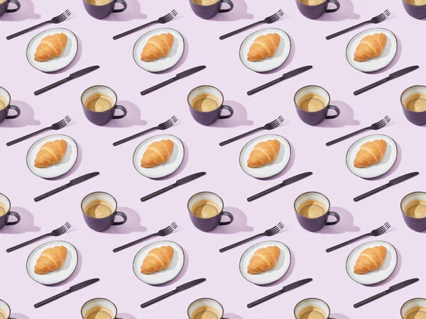 Black forks and knives, croissants and coffee on violet, seamless background pattern — Stock Photo