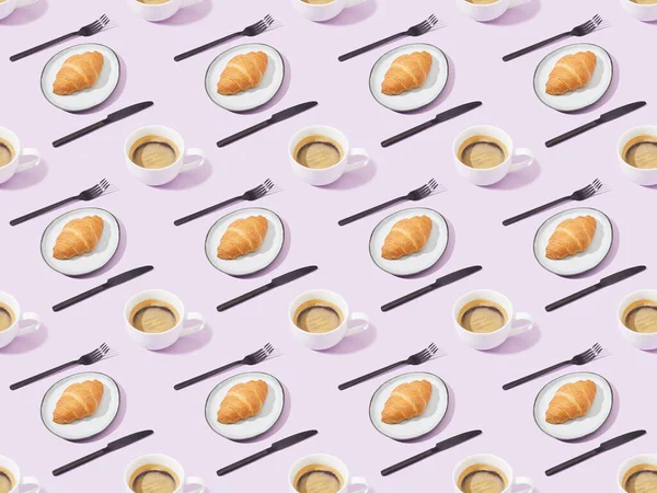 Back forks and knives, croissants and coffee on violet, seamless background pattern — Stock Photo