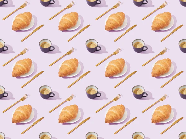 Golden forks and knives, croissants and coffee on violet, seamless background pattern — Stock Photo
