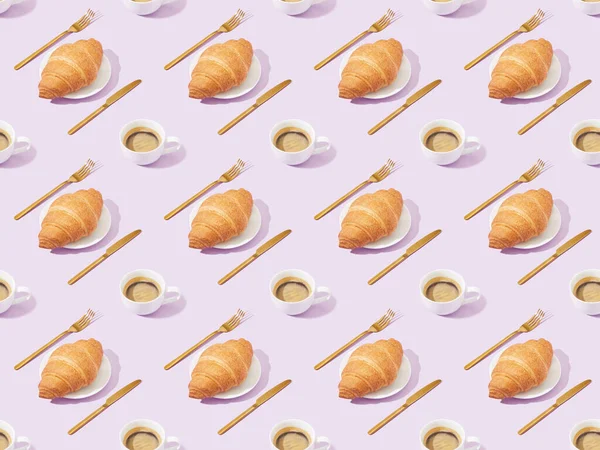 Golden forks and knives, croissants and coffee on violet, seamless background pattern — Stock Photo