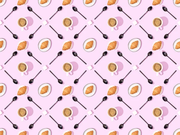 Top view of spoons, sugar, croissants on plates and coffee on pink, seamless background pattern — Stock Photo