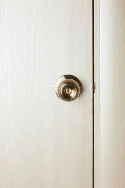 Clean white wooden door with metal handle after disinfection — Stock Photo