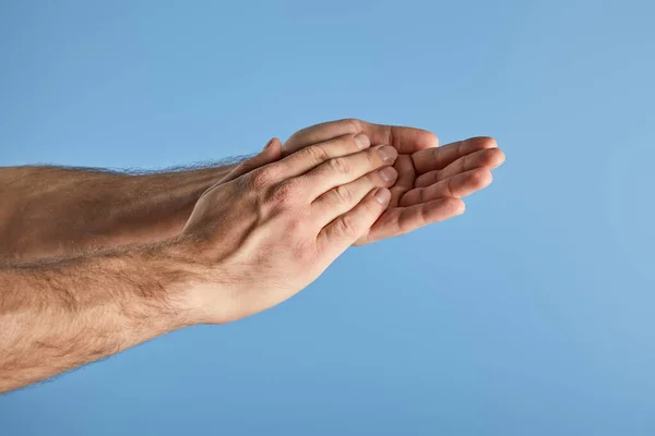 Cropped view of man washing hands isolated on blue — Stock Photo