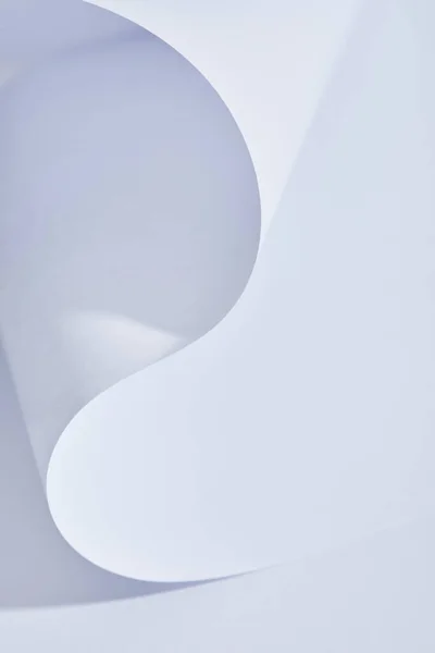 Close up view of curved paper sheet on white background — Stock Photo