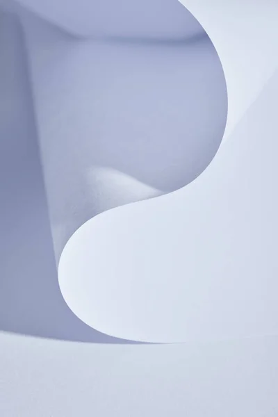 Close up view of curved paper sheet on white background — Stock Photo