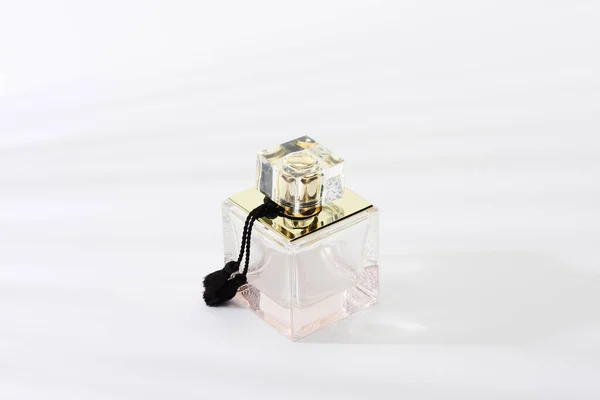 Luxury perfume bottle on white background — Stock Photo