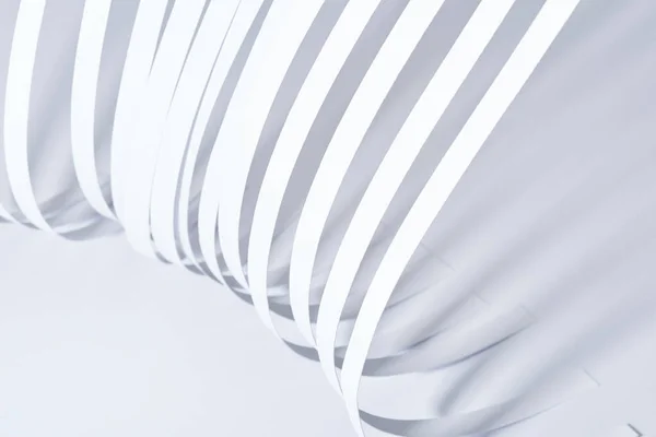 Close up view of curved paper stripes on white background — Stock Photo