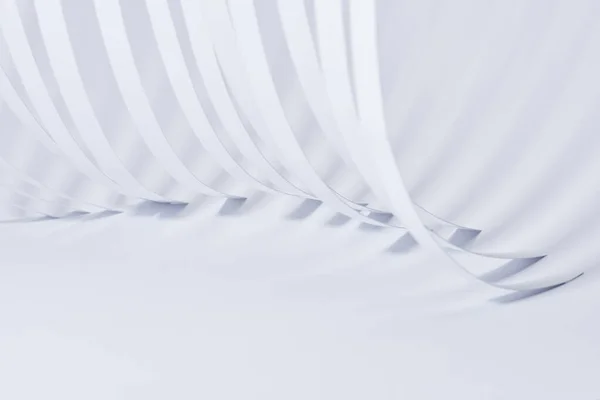 Close up view of curved paper stripes on white background — Stock Photo