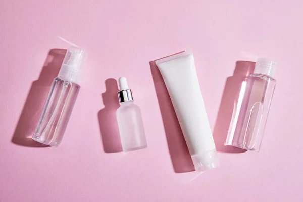 Top view of skincare set on pink background — Stock Photo