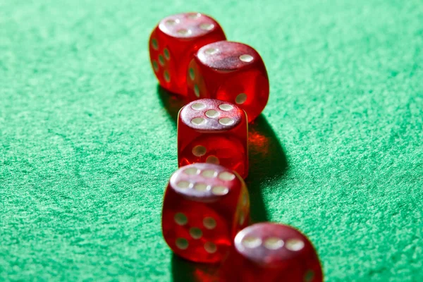 Selective focus of dice on green background — Stock Photo