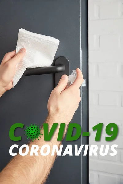 Partial view of man disinfecting metal door handle with antiseptic and napkin, covid-19 illustration — Stock Photo