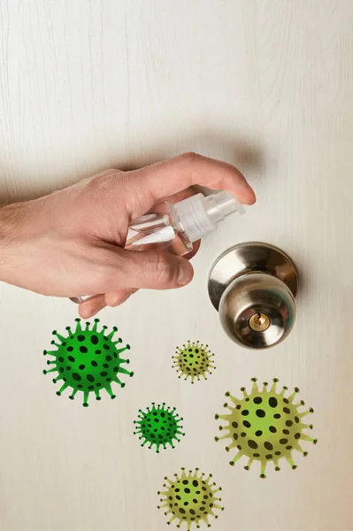 Cropped view of man disinfecting door handle with antiseptic, bacteria illustration — Stock Photo