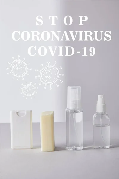 Hand sanitizer in spray bottles and antibacterial soap on white background, stop coronavirus illustration — Stock Photo