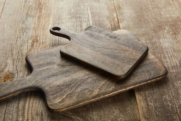 High angle view of cutting boards on wooden background — Stock Photo