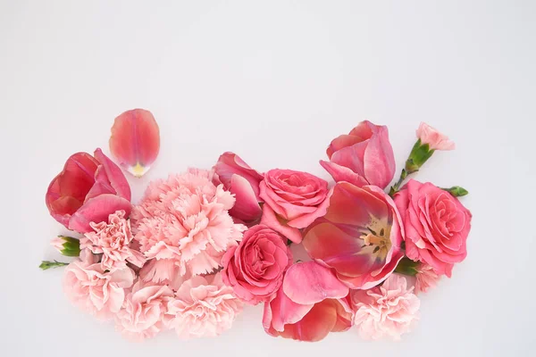 Top view of pink spring flowers on white background with copy space — Stock Photo