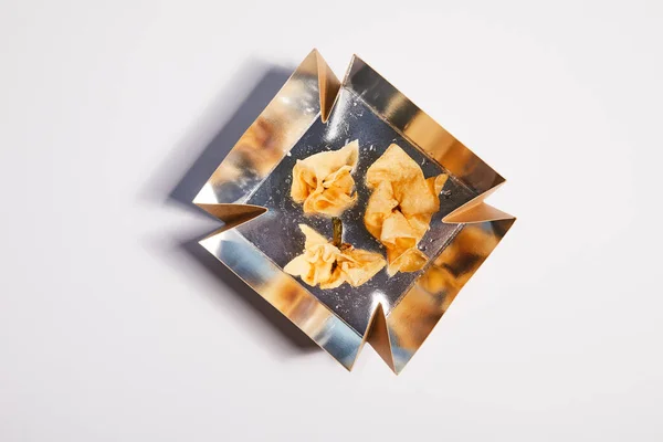 Top view of takeaway box with fried dumplings on white — Stock Photo