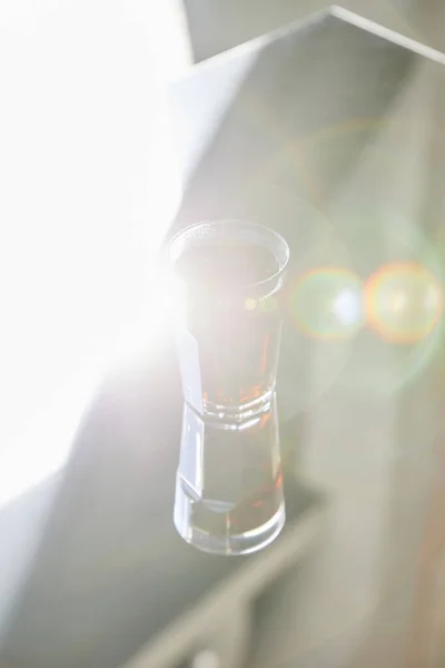 Fresh soda in glass with reflection in sunlight — Stock Photo