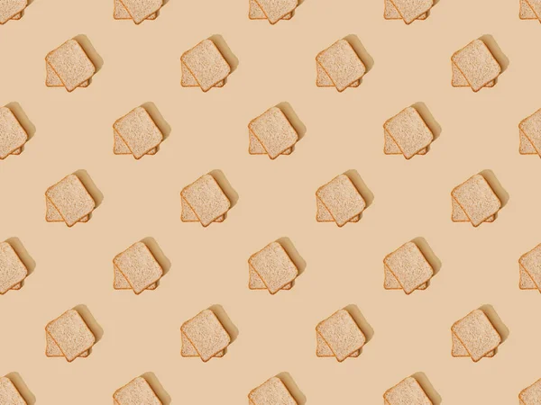 Top view of fresh toast bread on beige background, seamless pattern — Stock Photo