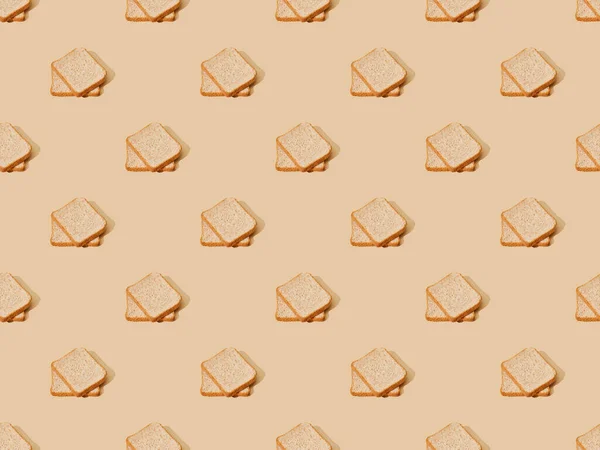 Fresh toast bread on beige background, seamless pattern — Stock Photo