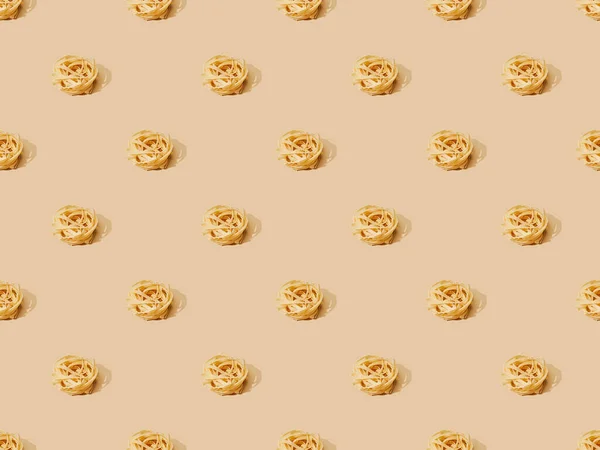 Fresh Tagliatelle on beige background, seamless pattern — Stock Photo