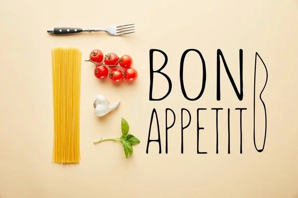 Flat lay with delicious spaghetti with tomato sauce ingredients on yellow background with bon appetit illustration — Stock Photo