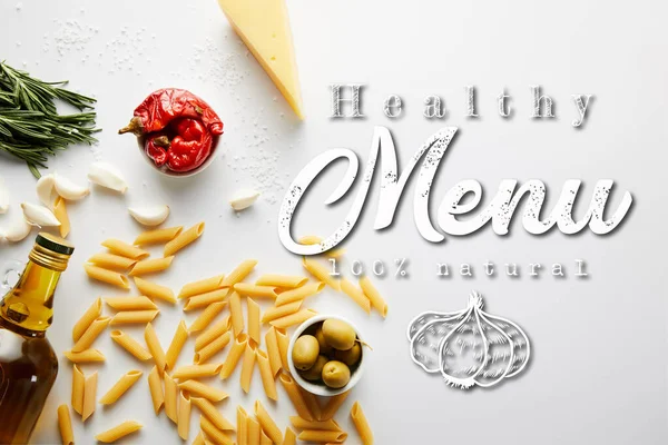 Top view of bottle of olive oil, pasta, cheese and ingredients on white background, healthy menu illustration — Stock Photo