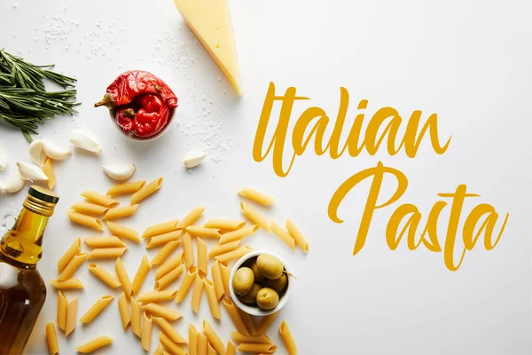 Top view of bottle of olive oil, pasta, cheese and ingredients on white background, italian pasta illustration — Stock Photo