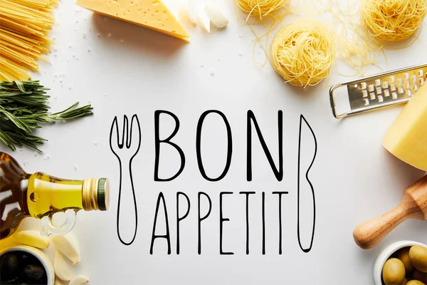 Top view of rolling pin, grater, bottle of olive oil, pasta and ingredients on white background, bon appetit illustration — Stock Photo