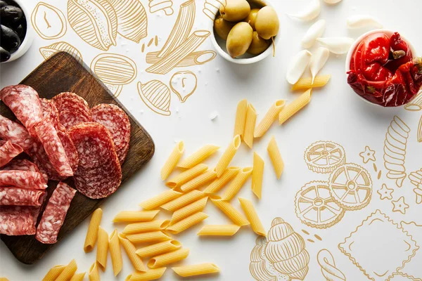 Top view of pasta, sea salt, garlic, meat platter and bowls with olives and marinated chili peppers on white background, food illustration — Stock Photo