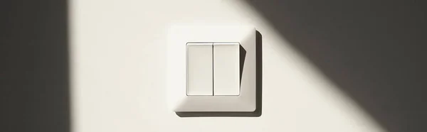 Horizontal image of white switch on wall in apartment — Stock Photo