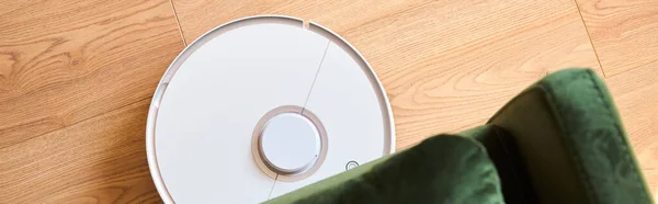 Panoramic concept of modern robotic vacuum cleaner washing floor — Stock Photo