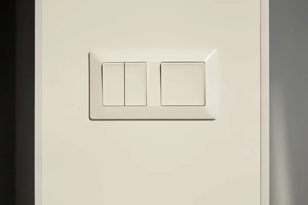 Modern switch on white wall in apartment — Stock Photo