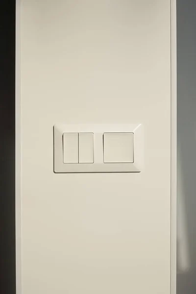 Modern switch on white wall at home — Stock Photo