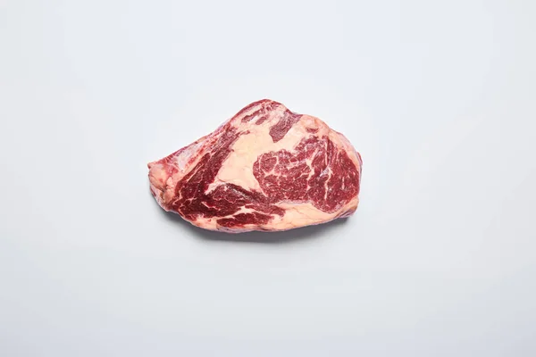 Fresh raw steak on on white background — Stock Photo