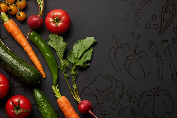 Top view of raw tasty vegetables with green leaves on black background with illustration — Stock Photo