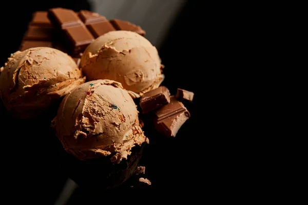 Fresh delicious chocolate ice cream on black — Stock Photo