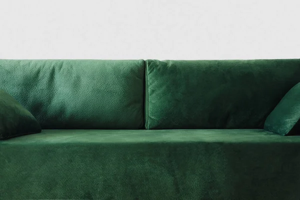 Close up view of modern green sofa with pillows in room — Stock Photo