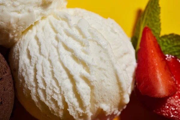 Close up view of tasty white ice cream with strawberry and mint — Stock Photo