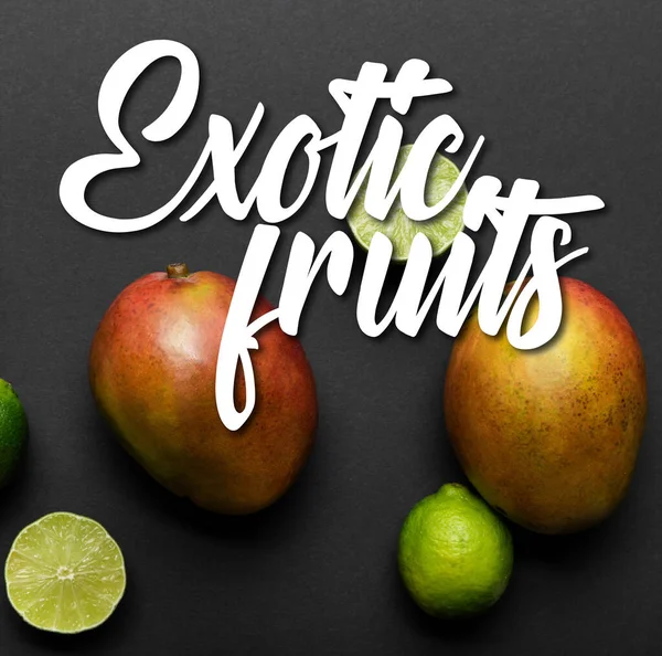 Top view of ripe limes and mango on black background with exotic fruits illustration — Stock Photo