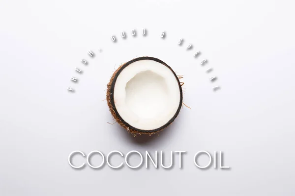 Top view of ripe coconut half on white background with coconut oil illustration — Stock Photo