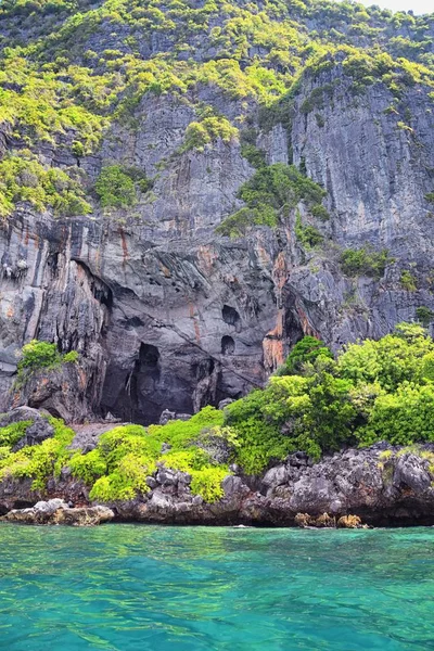 Island, Ocean views near Phuket Thailand with Blues, Turquoise and Greens oceans, mountains, boats, caves, trees resort island of phuket Thailand. Including Phi Phi, Ko Rang Yai, Ko Li Pe and other islands. Asia.