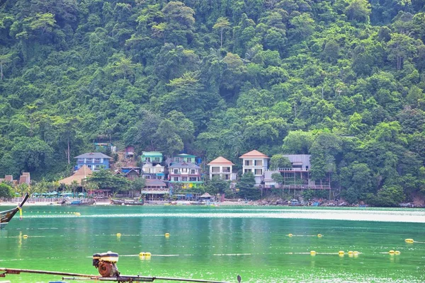 Island, Ocean views near Phuket Thailand with Blues, Turquoise and Greens oceans, mountains, boats, caves, trees resort island of phuket Thailand. Including Phi Phi, Ko Rang Yai, Ko Li Pe and other islands. Asia.