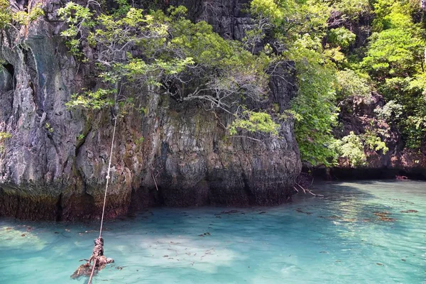 Island, Ocean views near Phuket Thailand with Blues, Turquoise and Greens oceans, mountains, boats, caves, trees resort island of phuket Thailand. Including Phi Phi, Ko Rang Yai, Ko Li Pe and other islands. Asia.