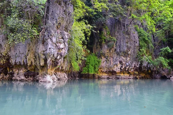 Island, Ocean views near Phuket Thailand with Blues, Turquoise and Greens oceans, mountains, boats, caves, trees resort island of phuket Thailand. Including Phi Phi, Ko Rang Yai, Ko Li Pe and other islands. Asia.