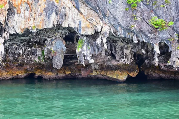 Island, Ocean views near Phuket Thailand with Blues, Turquoise and Greens oceans, mountains, boats, caves, trees resort island of phuket Thailand. Including Phi Phi, Ko Rang Yai, Ko Li Pe and other islands. Asia.