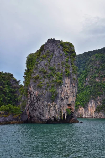 Island, Ocean views near Phuket Thailand with Blues, Turquoise and Greens oceans, mountains, boats, caves, trees resort island of phuket Thailand. Including Phi Phi, Ko Rang Yai, Ko Li Pe and other islands. Asia.