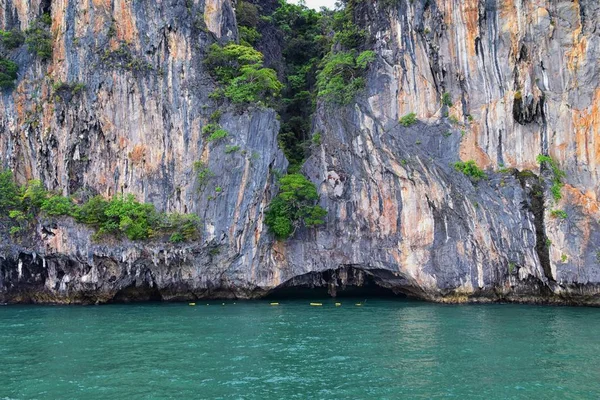 Island, Ocean views near Phuket Thailand with Blues, Turquoise and Greens oceans, mountains, boats, caves, trees resort island of phuket Thailand. Including Phi Phi, Ko Rang Yai, Ko Li Pe and other islands. Asia.