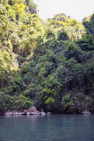 Island, Ocean views near Phuket Thailand with Blues, Turquoise and Greens oceans, mountains, boats, caves, trees resort island of phuket Thailand. Including Phi Phi, Ko Rang Yai, Ko Li Pe and other islands. Asia.