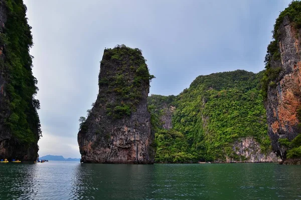 Island, Ocean views near Phuket Thailand with Blues, Turquoise and Greens oceans, mountains, boats, caves, trees resort island of phuket Thailand. Including Phi Phi, Ko Rang Yai, Ko Li Pe and other islands. Asia.