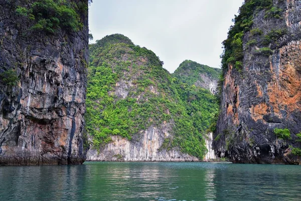 Island, Ocean views near Phuket Thailand with Blues, Turquoise and Greens oceans, mountains, boats, caves, trees resort island of phuket Thailand. Including Phi Phi, Ko Rang Yai, Ko Li Pe and other islands. Asia.